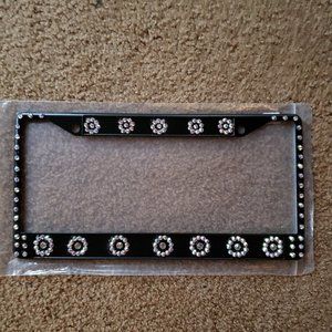 Metal license plate holder with crystals